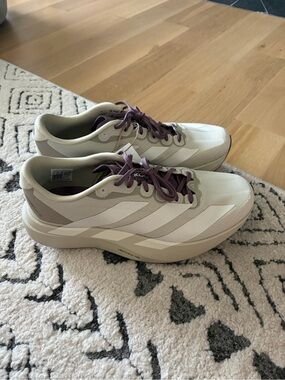 adidas Men's Athletic Shoes in Cream with Purple Laces